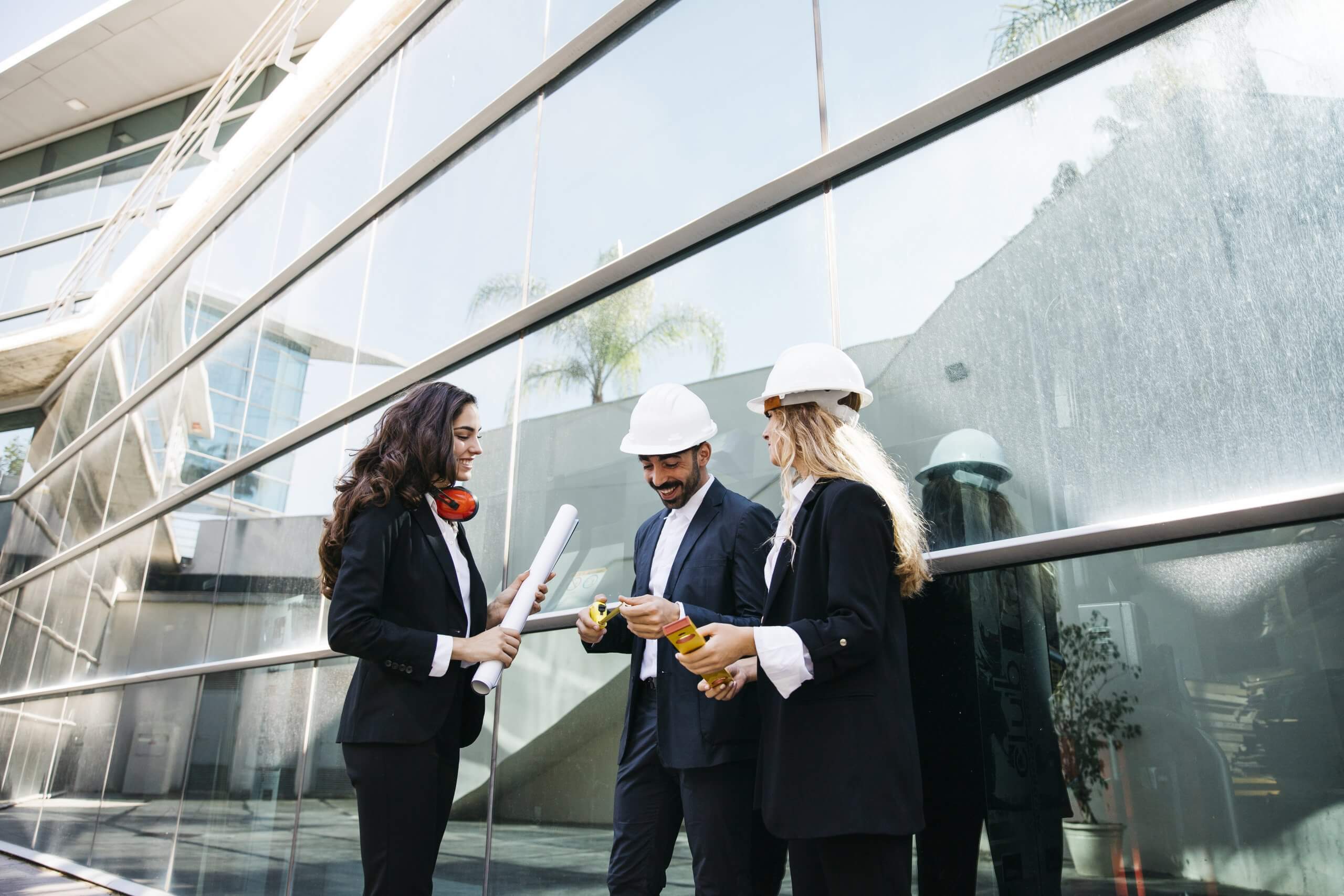architects-wearing-helmets-plans ISO 41001 Certification Malaysia